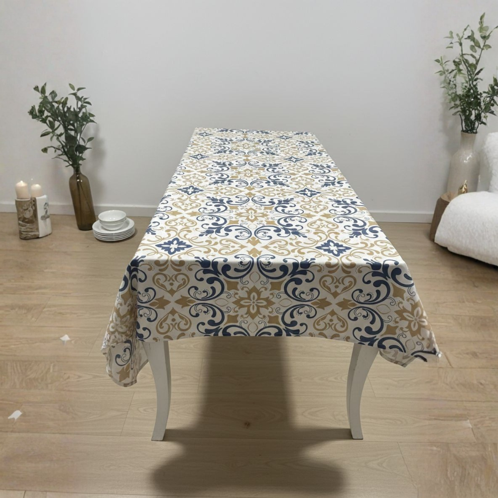 Table with a patterned tablecloth in a room with decor elements.