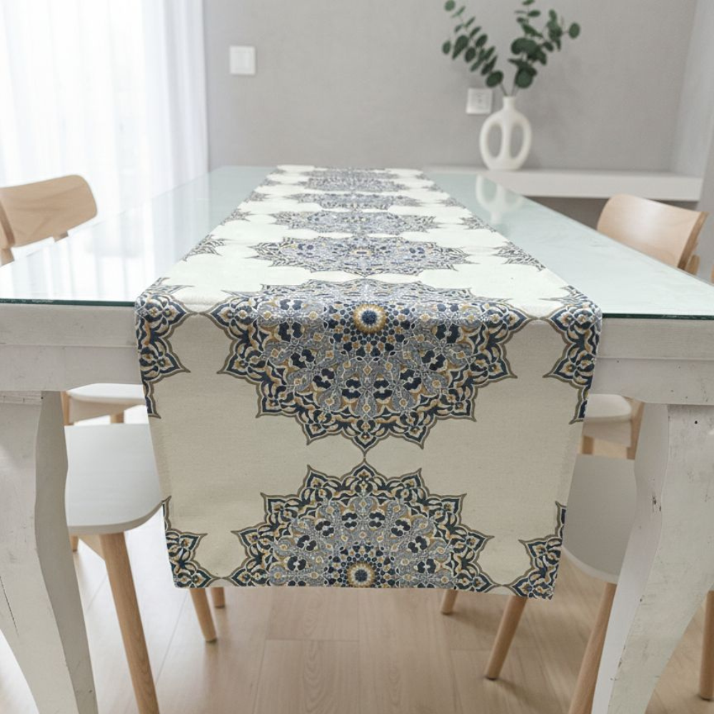Dining table with a decorative table runner featuring mandala patterns.