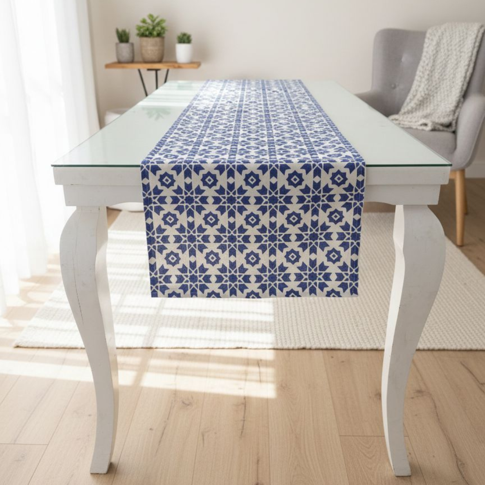 Table with a blue patterned table runner in a bright room.